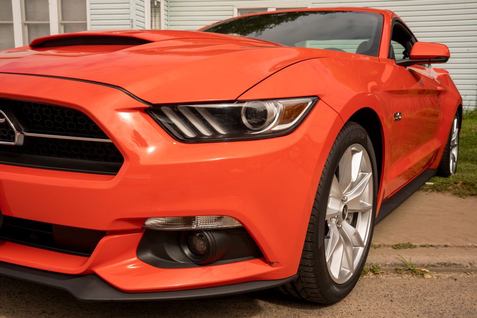 Shiny sports car exterior with premium ceramic coating applied